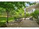 Outdoor patio with outdoor dining set surrounded by trees at 10356 Lions Heart, Lone Tree, CO 80124