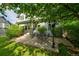 Outdoor patio area with patio table and chairs surrounded by mature trees at 10356 Lions Heart, Lone Tree, CO 80124