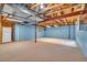 Unfinished basement with exposed ceiling, support beams, and ample open space at 10356 Lions Heart, Lone Tree, CO 80124