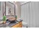 Well-appointed bathroom with custom sink, modern fixtures, and a clean, bright aesthetic at 10356 Lions Heart, Lone Tree, CO 80124