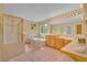 Relaxing primary bathroom featuring a separate shower and tub, double vanity, and ample lighting at 10356 Lions Heart, Lone Tree, CO 80124