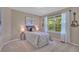 Bright bedroom featuring large window, neutral tones, and stylish decor at 10356 Lions Heart, Lone Tree, CO 80124