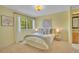 A bright bedroom provides an en suite bathroom and a window view at 10356 Lions Heart, Lone Tree, CO 80124