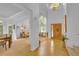 Bright foyer with high ceilings, hardwood floors, and a view into the living room and dining room at 10356 Lions Heart, Lone Tree, CO 80124