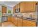 Kitchen with wood floors, black granite countertops and stainless steel appliances at 10356 Lions Heart, Lone Tree, CO 80124