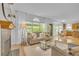 Inviting living area with fireplace, large windows, and open access to dining and kitchen spaces at 10356 Lions Heart, Lone Tree, CO 80124