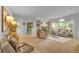 Open concept living room with cozy seating, fireplace, and neutral tones throughout the space at 10356 Lions Heart, Lone Tree, CO 80124