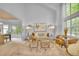 Bright living room featuring vaulted ceilings, large windows, a neutral color palette and modern decor at 10356 Lions Heart, Lone Tree, CO 80124