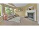 Cozy seating area with fireplace and natural light in a large main bedroom at 10356 Lions Heart, Lone Tree, CO 80124