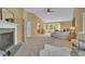 Expansive main bedroom with fireplace, seating area, and ensuite bath at 10356 Lions Heart, Lone Tree, CO 80124