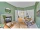 Well-lit office space with fireplace, ample storage, and neutral finishes at 10356 Lions Heart, Lone Tree, CO 80124