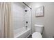 Well-lit bathroom features tiled shower/tub combo with modern fixtures at 14435 E 1St Dr # B2, Aurora, CO 80011