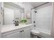 Bathroom with tile backsplash, updated vanity, and bath and shower combo at 14435 E 1St Dr # B2, Aurora, CO 80011