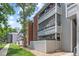 Building exterior showcases well-maintained landscaping and multiple units with private outdoor spaces at 14435 E 1St Dr # B2, Aurora, CO 80011