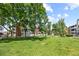 Beautiful condo community boasts lush lawns, mature trees, and easy walking access at 14435 E 1St Dr # B2, Aurora, CO 80011