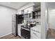 Modern kitchen with granite counters, stainless appliances, and ample cabinet space at 14435 E 1St Dr # B2, Aurora, CO 80011