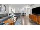Spacious open-plan room features seating, dining and access to the kitchen at 14435 E 1St Dr # B2, Aurora, CO 80011