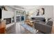 Cozy living room with a brick fireplace, sliding glass doors to balcony, and comfortable seating at 14435 E 1St Dr # B2, Aurora, CO 80011