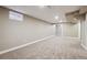 Large basement with neutral carpet, ample natural light, and versatile space for various living arrangements at 10505 Clarkson St, Northglenn, CO 80233