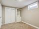 Cozy bedroom features plush carpet, a built in shelf, closet, natural light, and neutral paint at 10505 Clarkson St, Northglenn, CO 80233