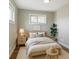 Cozy bedroom featuring neutral colors, wood floors, and natural light at 10505 Clarkson St, Northglenn, CO 80233