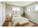 Serene bedroom with neutral tones, hardwood floors, and ample natural light at 10505 Clarkson St, Northglenn, CO 80233