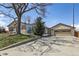 Charming home with a well-maintained lawn and driveway, mature tree, and attached garage at 10505 Clarkson St, Northglenn, CO 80233