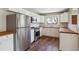 Bright kitchen with stainless steel refrigerator and appliances, white cabinets, and butcher block counters at 10505 Clarkson St, Northglenn, CO 80233