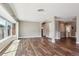 Spacious living room featuring hardwood floors, large windows, and neutral paint colors at 10505 Clarkson St, Northglenn, CO 80233