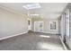 Bright sunroom featuring a skylight, large windows, and neutral decor at 10505 Clarkson St, Northglenn, CO 80233
