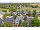 Aerial view of the property in a neighborhood with mature trees at 10553 Stonemeadow Dr, Parker, CO 80134