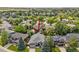 Aerial view of property in a neighborhood with mature trees at 10553 Stonemeadow Dr, Parker, CO 80134