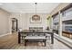 Formal dining room featuring a wooden table, modern chandelier, and ample natural light at 10553 Stonemeadow Dr, Parker, CO 80134