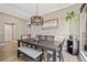 Bright dining room with wood floors, modern lighting, and stylish decor at 10553 Stonemeadow Dr, Parker, CO 80134