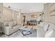 Open-concept living room and dining area with stylish furniture and neutral decor at 10553 Stonemeadow Dr, Parker, CO 80134