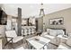 Inviting living room with a kitchen view, fireplace, modern décor, and bar stool seating at 10553 Stonemeadow Dr, Parker, CO 80134