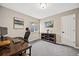 Home office with a desk, shelves, and carpeted floor, perfect for remote work at 10553 Stonemeadow Dr, Parker, CO 80134