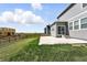 A charming home offers a concrete patio and spacious backyard with a wood fence at 226 Racer St, Bennett, CO 80102