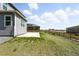 Expansive backyard with green lawn, patio, and wood fence at 226 Racer St, Bennett, CO 80102
