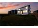 Home's backyard showcasing a spacious lawn, fenced perimeter, and serene surroundings at 226 Racer St, Bennett, CO 80102