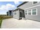 The backyard features a concrete patio and sliding glass door access to the home's interior at 226 Racer St, Bennett, CO 80102