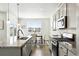 Bright, modern kitchen features granite countertops and stainless steel appliances at 226 Racer St, Bennett, CO 80102