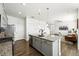 Modern kitchen with a large island and open layout that flows into a comfortable living area at 226 Racer St, Bennett, CO 80102