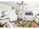 Cozy living room features hardwood-style floors, neutral tones, and seamless flow to the stairway at 226 Racer St, Bennett, CO 80102