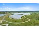 Picturesque aerial view of a scenic lake with community path at 12826 Lake Port St, Longmont, CO 80504