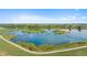 Picturesque aerial view of a scenic lake and walking path at 12826 Lake Port St, Longmont, CO 80504