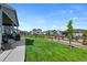 Beautiful backyard with a spacious lawn and a wooden fence providing privacy at 12826 Lake Port St, Longmont, CO 80504