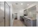 Spacious bathroom with double sinks, walk-in shower, and ample storage at 12826 Lake Port St, Longmont, CO 80504