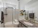 Modern bathroom with glass shower, granite counters, and stylish tile at 12826 Lake Port St, Longmont, CO 80504