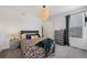 Well-lit bedroom with a comfortable bed, stylish decor, and ample natural light at 12826 Lake Port St, Longmont, CO 80504